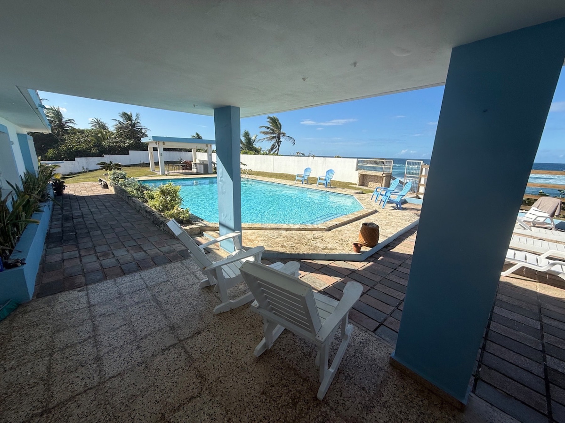 Covered terrace facing the pool